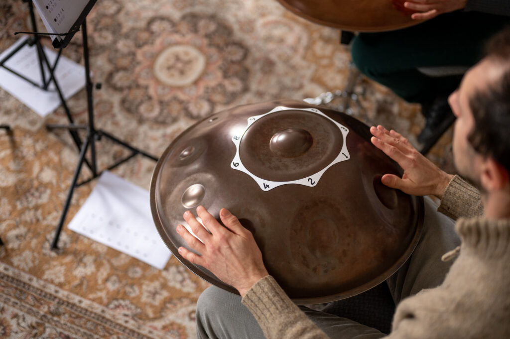Best handpan - how to tell which is the best for you? 3 Handpan with numbered tone fields at a workshop